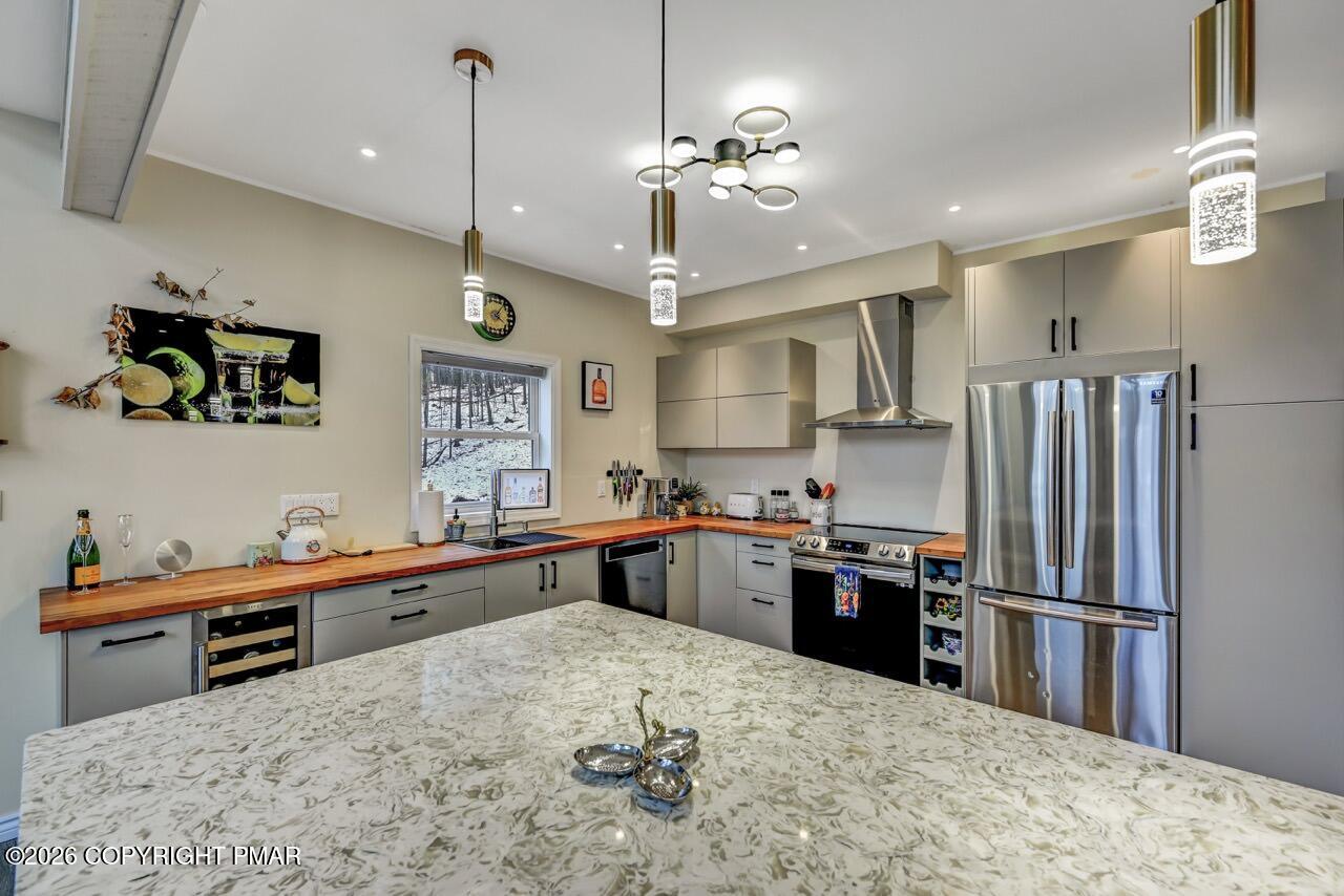 325 Chestnut Road East Stroudsburg, PA 18302 - Photo 17 of 50 a kitchen with stainless steel appliances granite countertop a sink refrigerator and microwave