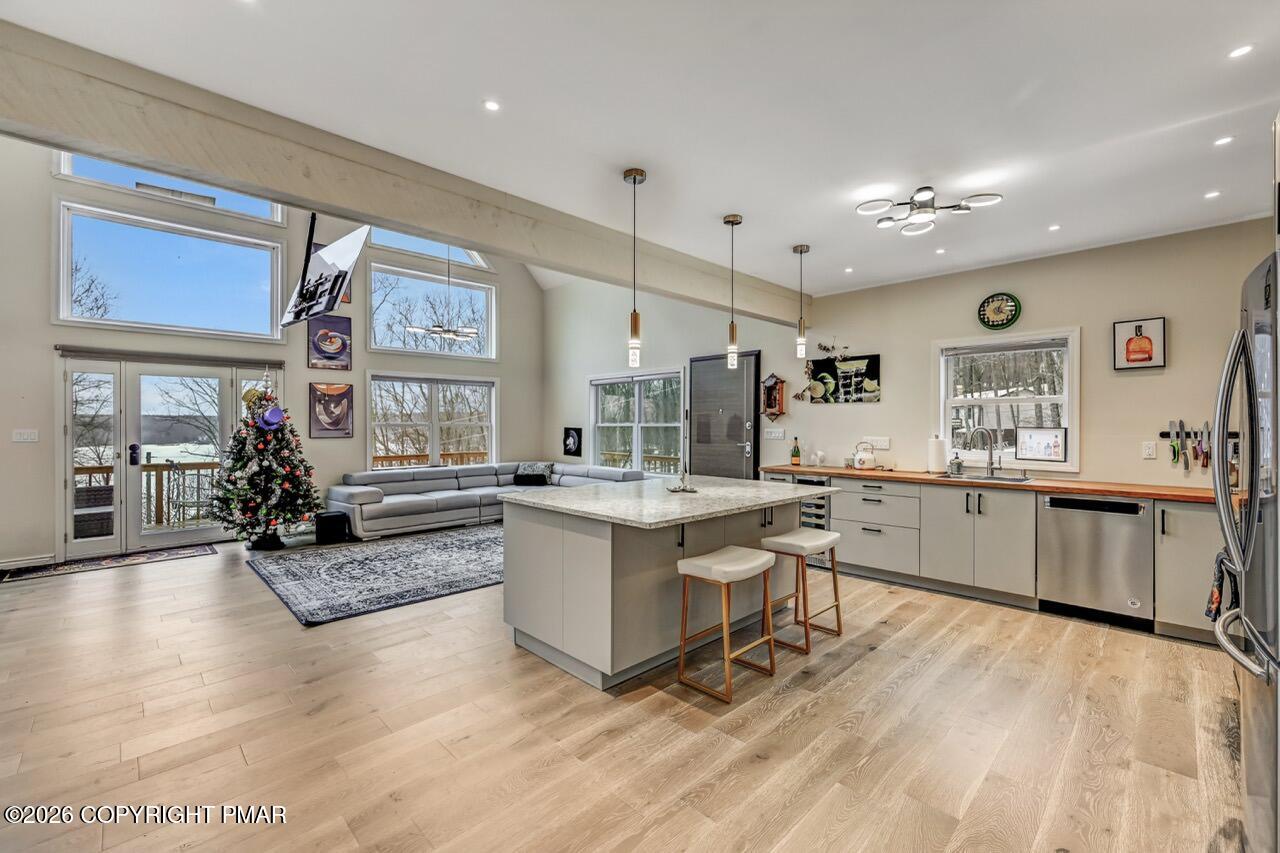325 Chestnut Road East Stroudsburg, PA 18302 - Photo 19 of 50 a large white kitchen with a large window and stainless steel appliances