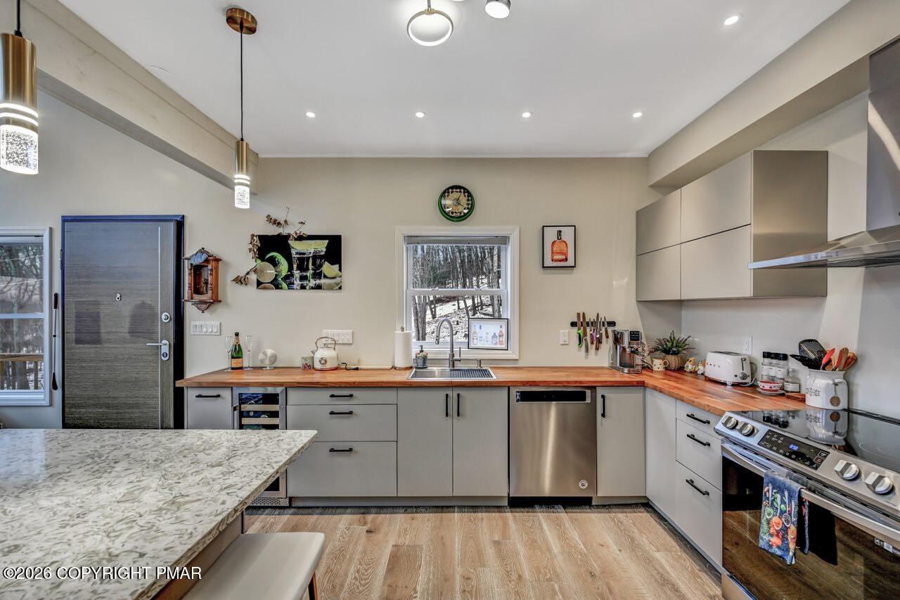 325 Chestnut Road East Stroudsburg, PA 18302 - Photo 20 of 50 a kitchen with stainless steel appliances granite countertop a lot of counter space and wooden floors