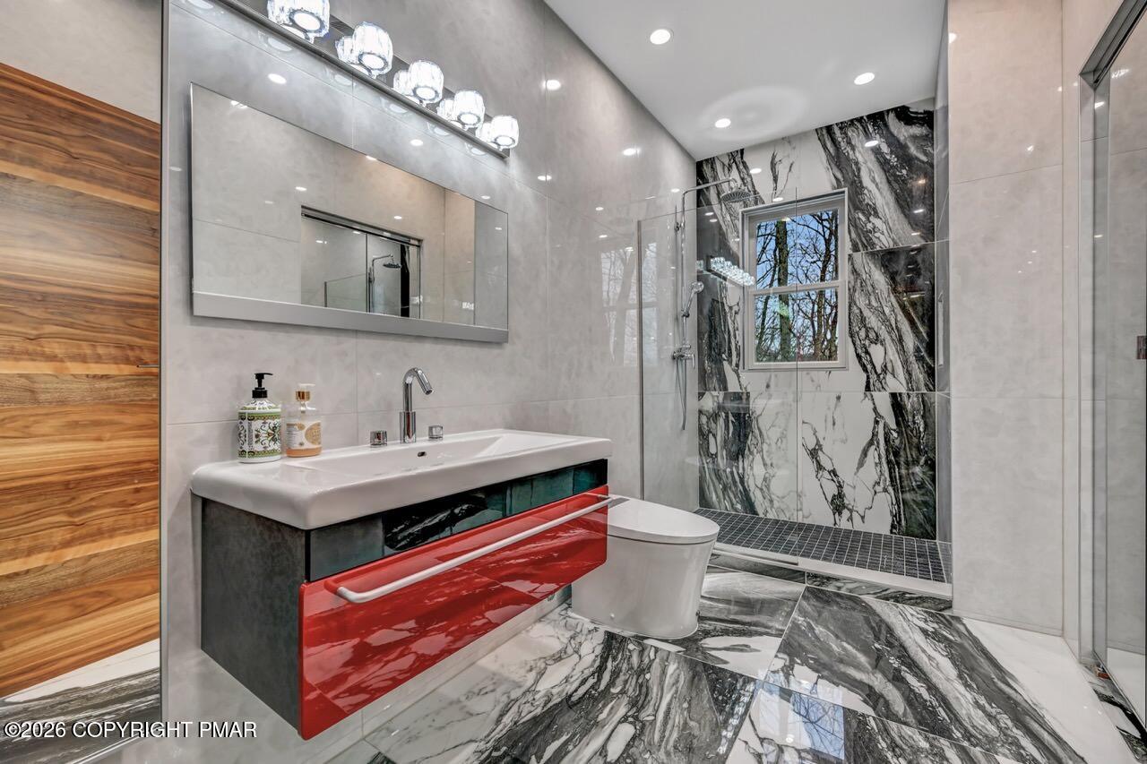 325 Chestnut Road East Stroudsburg, PA 18302 - Photo 23 of 50 a bathroom with a sink a toilet and shower