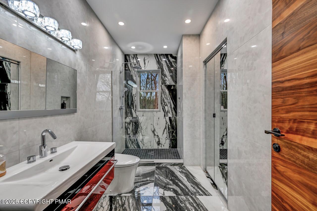 325 Chestnut Road East Stroudsburg, PA 18302 - Photo 24 of 50 a bathroom with a double vanity sink mirror and shower