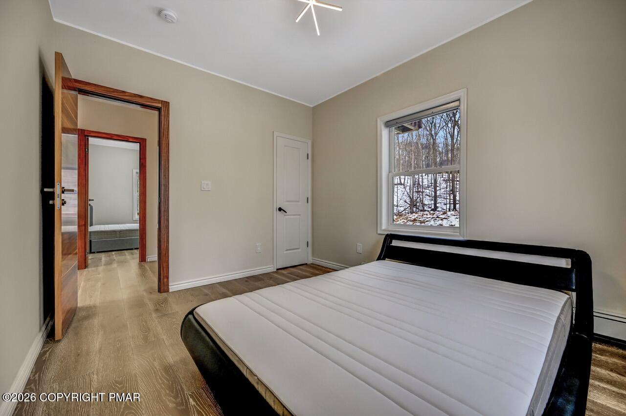 325 Chestnut Road East Stroudsburg, PA 18302 - Photo 27 of 50 a bedroom with a bed and a painting on the wall