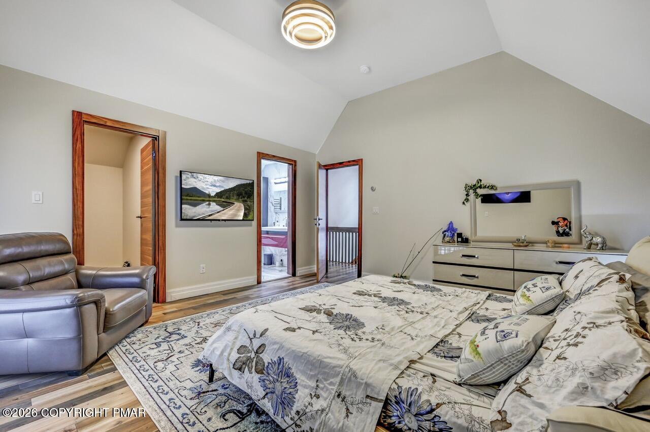 325 Chestnut Road East Stroudsburg, PA 18302 - Photo 35 of 50 a bedroom with a bed and wooden floor