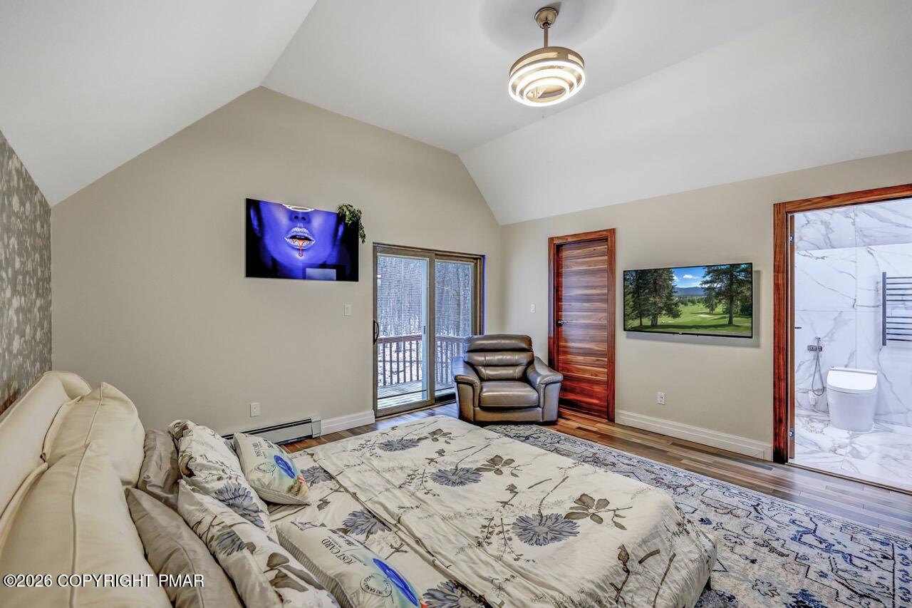 325 Chestnut Road East Stroudsburg, PA 18302 - Photo 37 of 50 a bedroom with a bed dresser and wooden floor