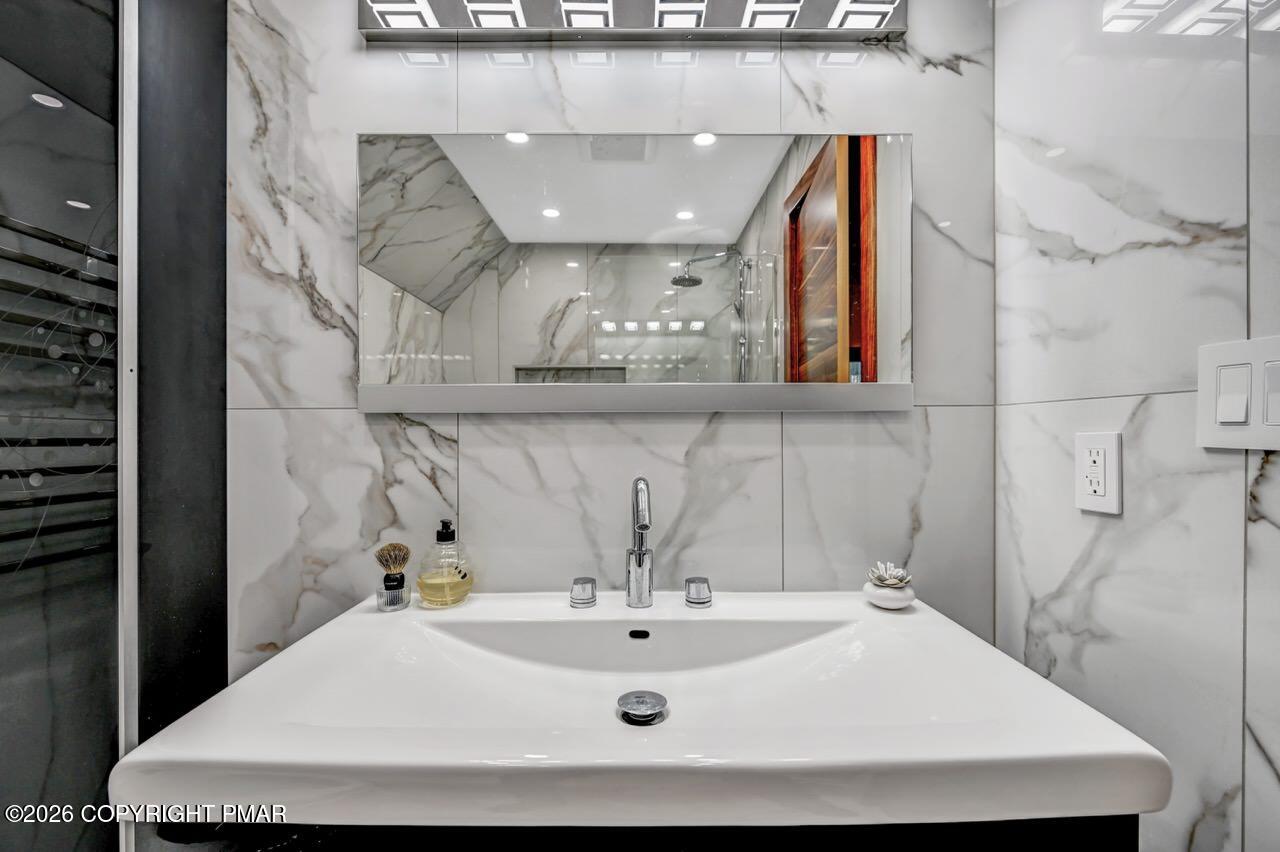 325 Chestnut Road East Stroudsburg, PA 18302 - Photo 42 of 50 a bathroom with a sink and mirror