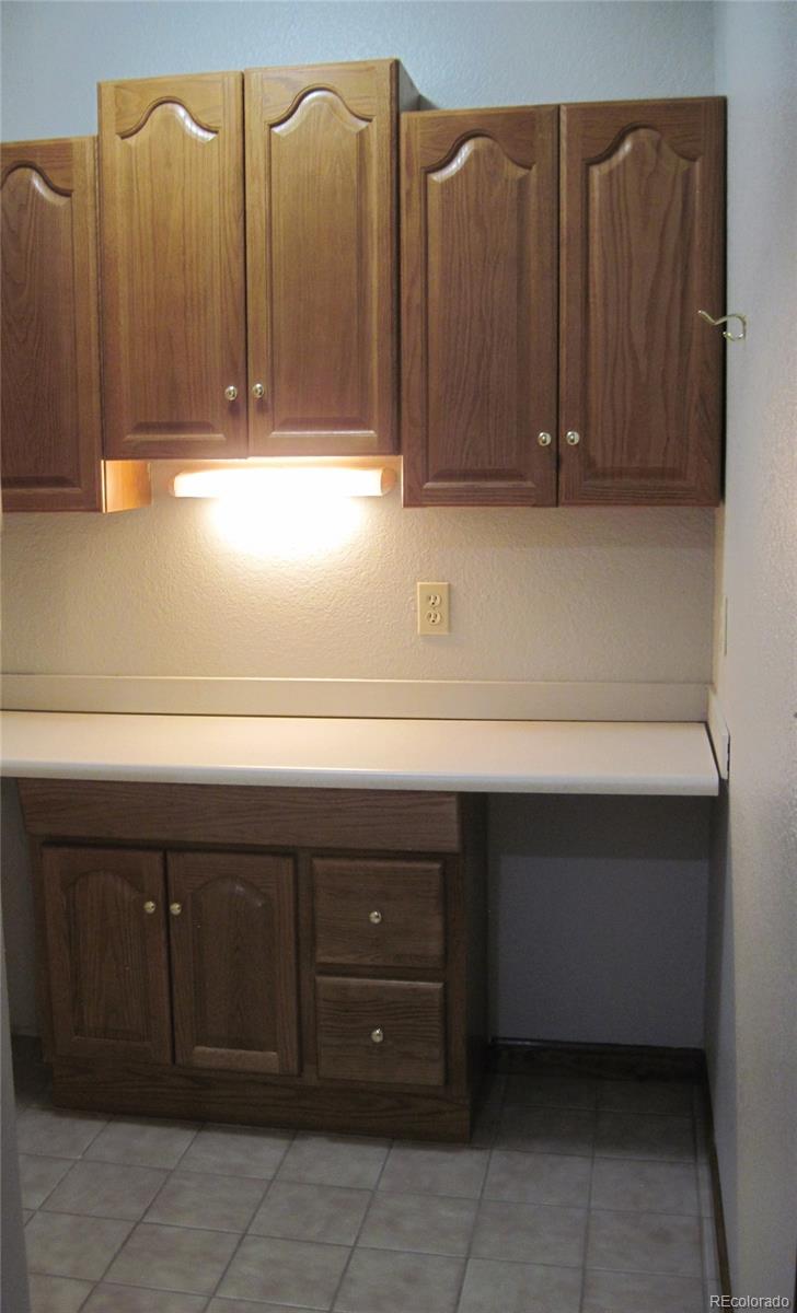 655 Harness Road Monument, CO 80132 - Photo 34 of 42 a kitchen with a sink and cabinets