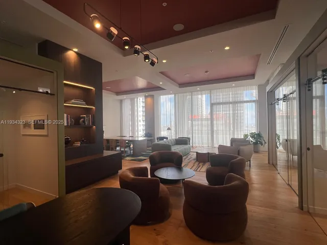 a lobby with furniture and window