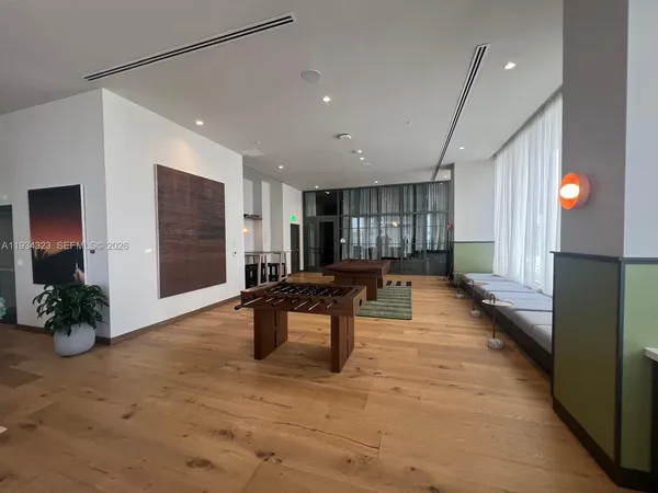 a lobby with furniture and windows