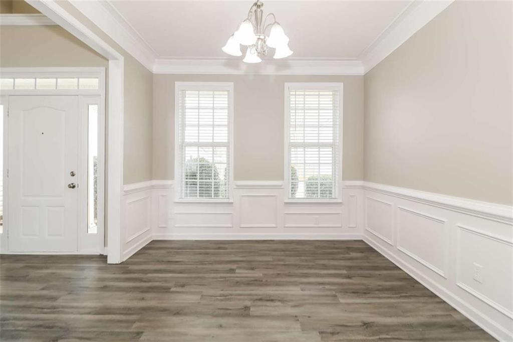 2312 Temple View Drive Snellville, GA 30078 - Photo 12 of 15 a view of an empty room with wooden floor and a window