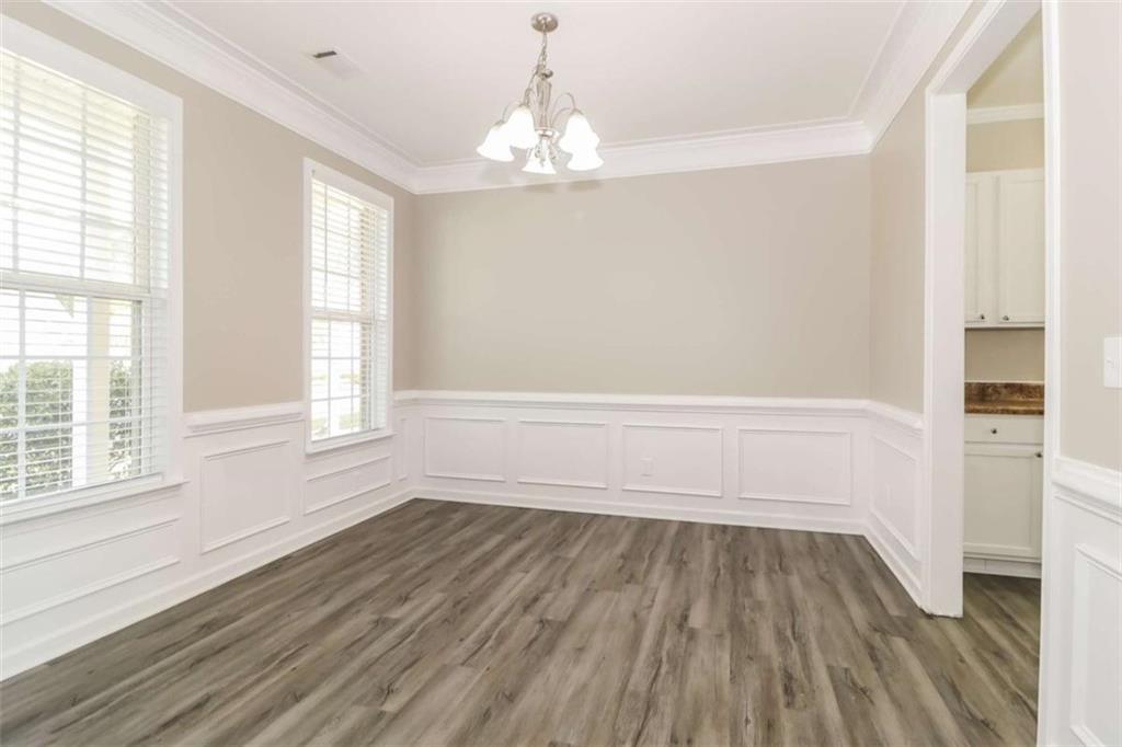 2312 Temple View Drive Snellville, GA 30078 - Photo 13 of 15 a view of wooden floor and windows in a room
