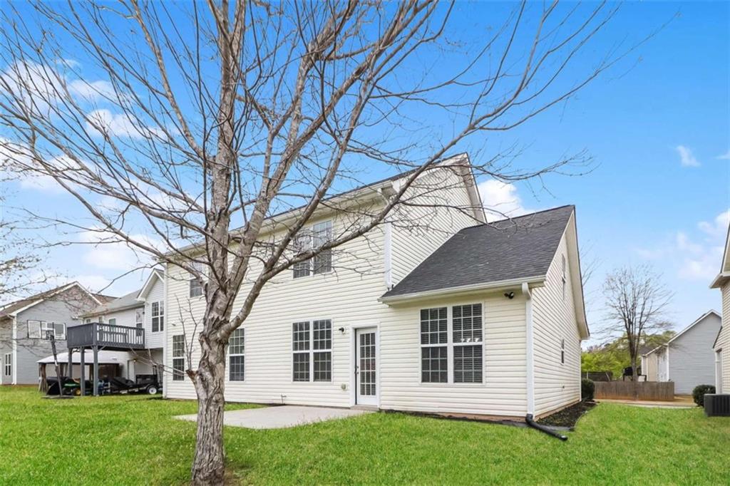 2312 Temple View Drive Snellville, GA 30078 - Photo 4 of 15 a front view of a house with a yard