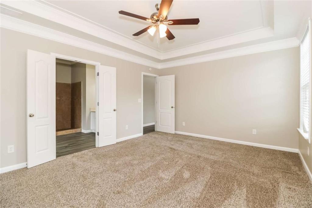 2312 Temple View Drive Snellville, GA 30078 - Photo 5 of 15 an empty room with closet and a ceiling fan