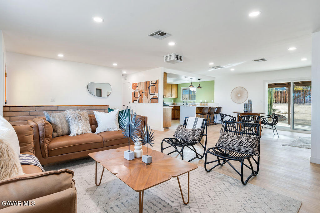 73843 White Sands Drive Twentynine Palms, CA 92277 - Photo 12 of 32 a living room with lots of furniture and a wooden floor