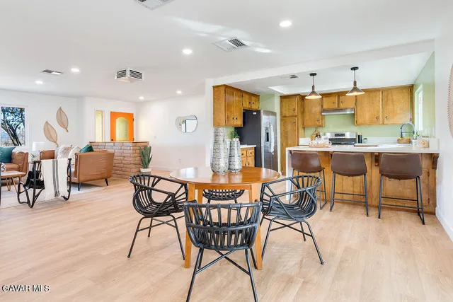 a dining room with furniture and window