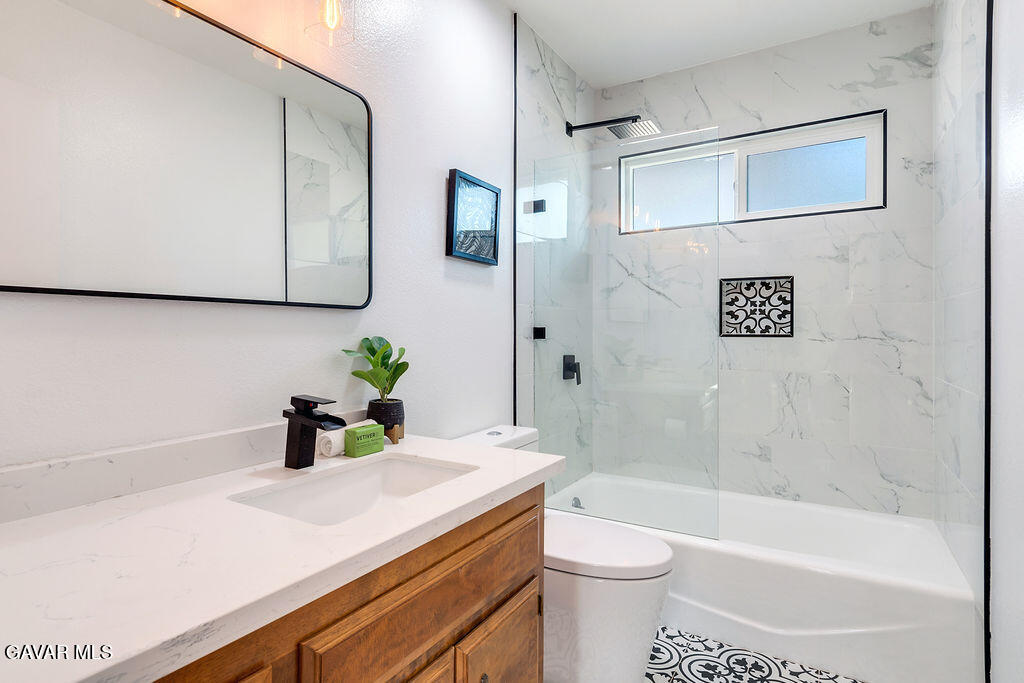 73843 White Sands Drive Twentynine Palms, CA 92277 - Photo 19 of 32 a bathroom with a sink a toilet and shower