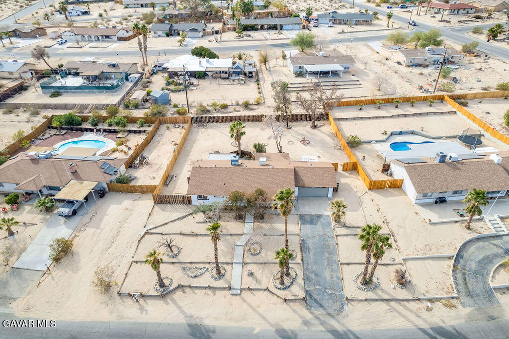 73843 White Sands Drive Twentynine Palms, CA 92277 - Photo 2 of 32 an aerial view of residential houses with outdoor space