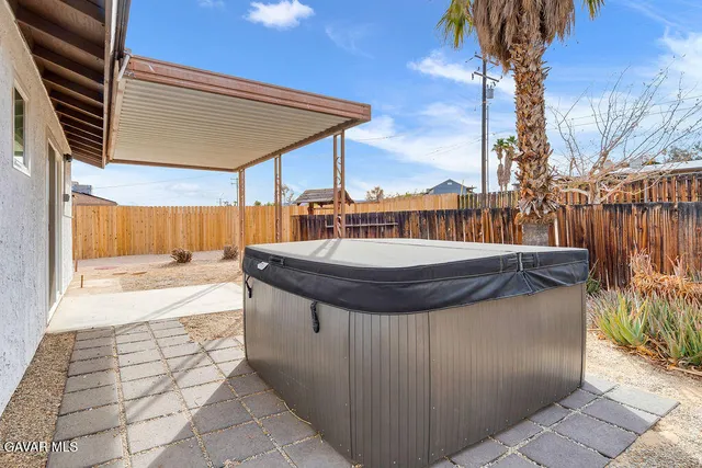 a view of swimming pool with a patio
