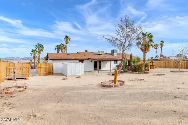 a view of a house with a snow on the road