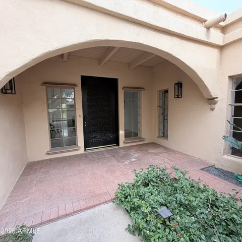a view of a hallway with a kitchen
