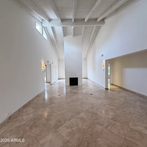 a view of a hallway with chandelier