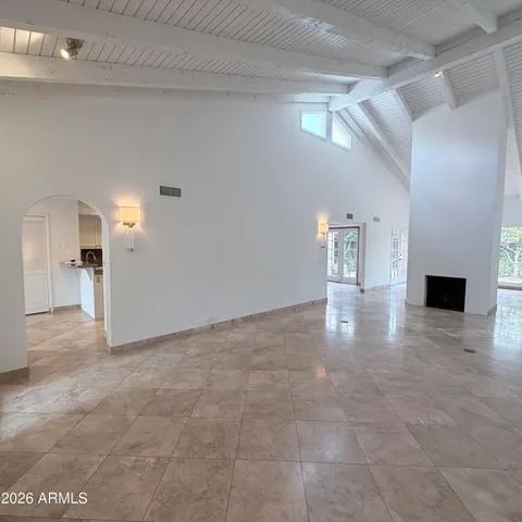 a kitchen with granite countertop white cabinets and sink
