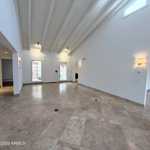 a kitchen with white cabinets and appliances