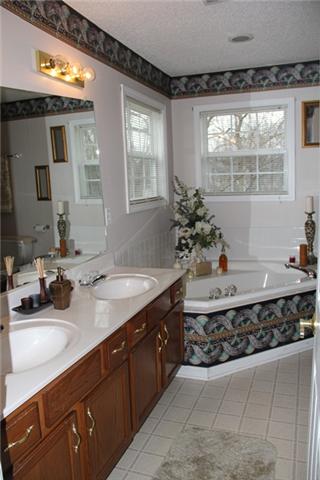 1682 Windriver Road Clarksville, TN 37042 - Photo 11 of 19 The master bath has a double vanity, large soaking tub and seperate shower.