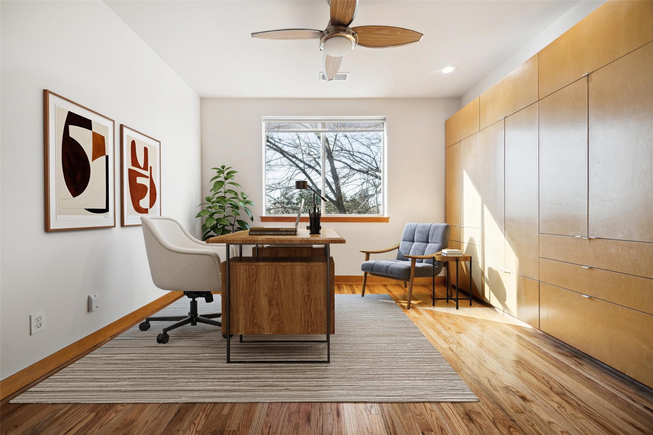 94 Drew Street, Unit C Houston, TX 77006 - Photo 22 of 29 Virtually staged loft showcasing a spacious layout, abundant natural light, and a full wall of storage—making organization effortless.