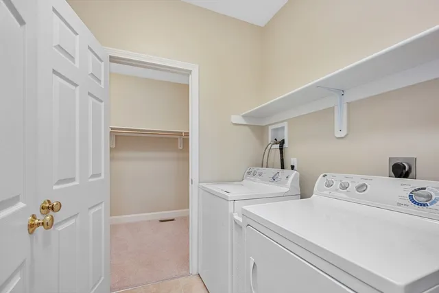 a living room with furniture a flat screen tv and a window