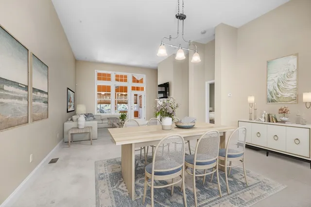 a large kitchen with a table and chairs