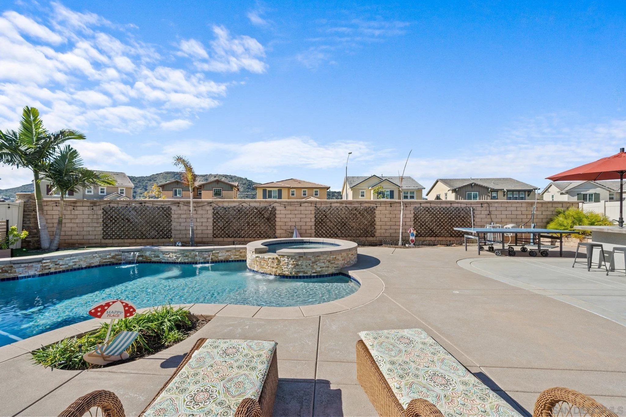 a view of a swimming pool and lounge chair