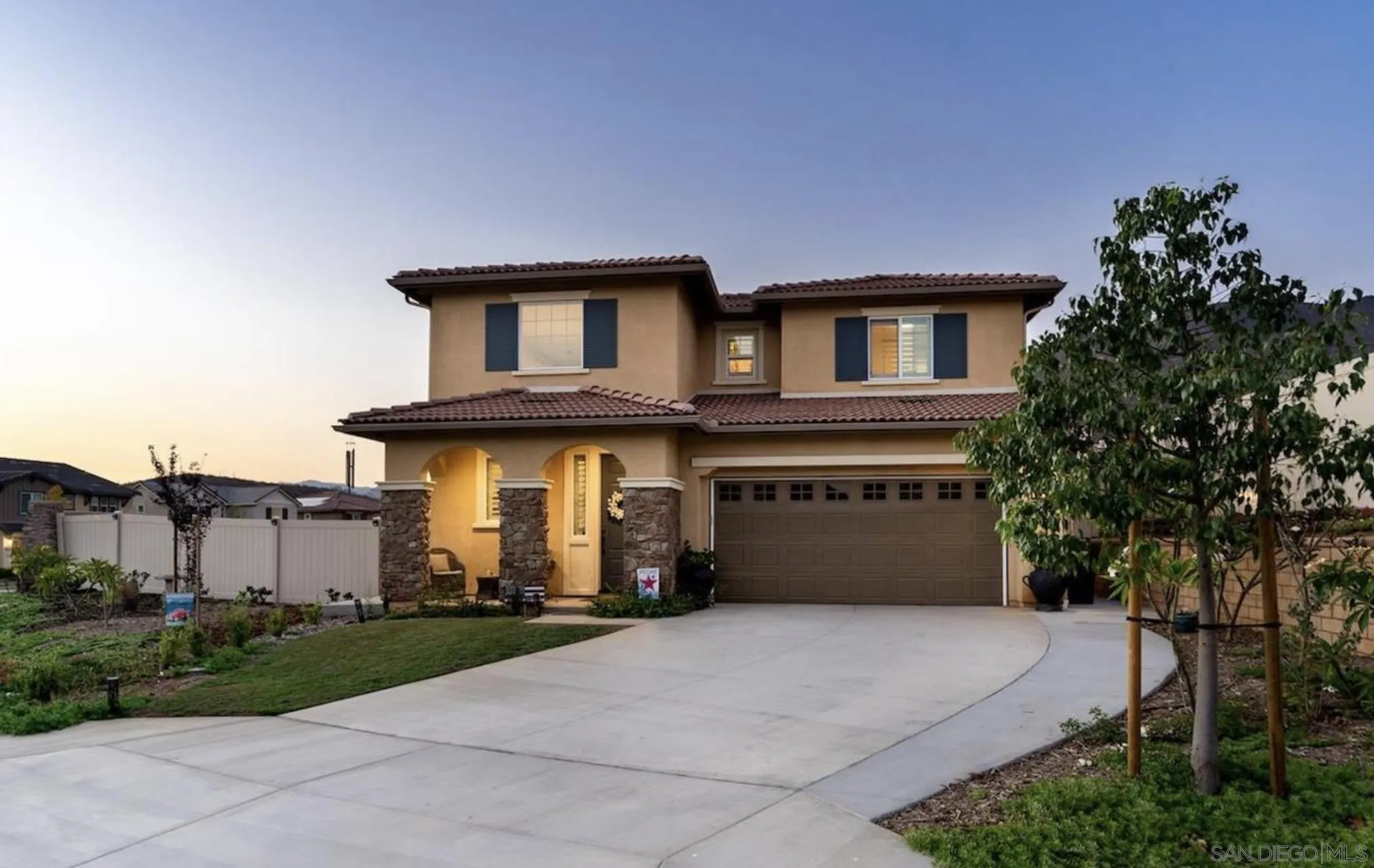 35778 Esperia Way Fallbrook, CA 92028 - Photo 18 of 44 a front view of a house with a yard and garage