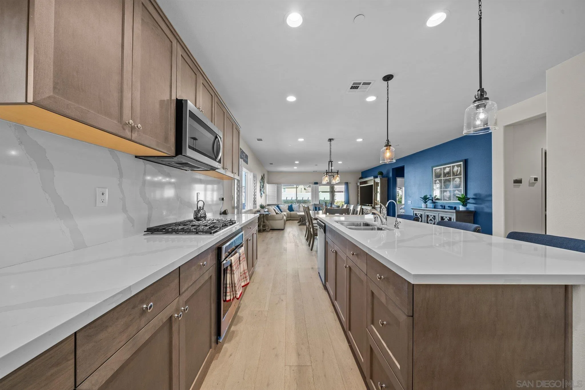 35778 Esperia Way Fallbrook, CA 92028 - Photo 22 of 44 a kitchen with stainless steel appliances granite countertop lots of counter top space a sink a stove and a refrigerator