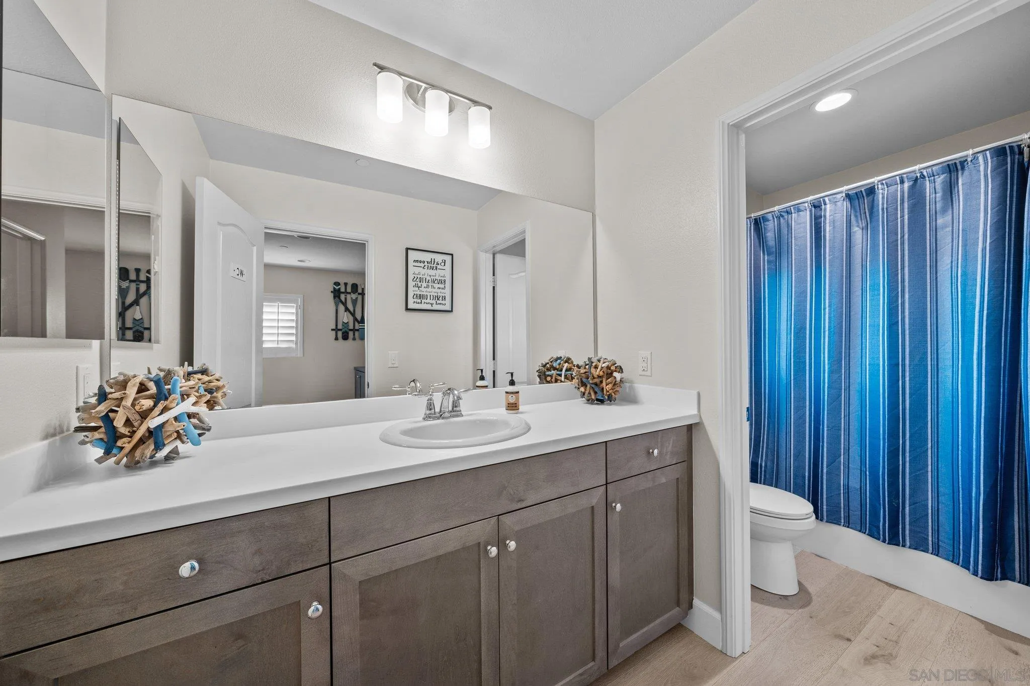 35778 Esperia Way Fallbrook, CA 92028 - Photo 40 of 44 a bathroom with a double vanity sink mirror and toilet
