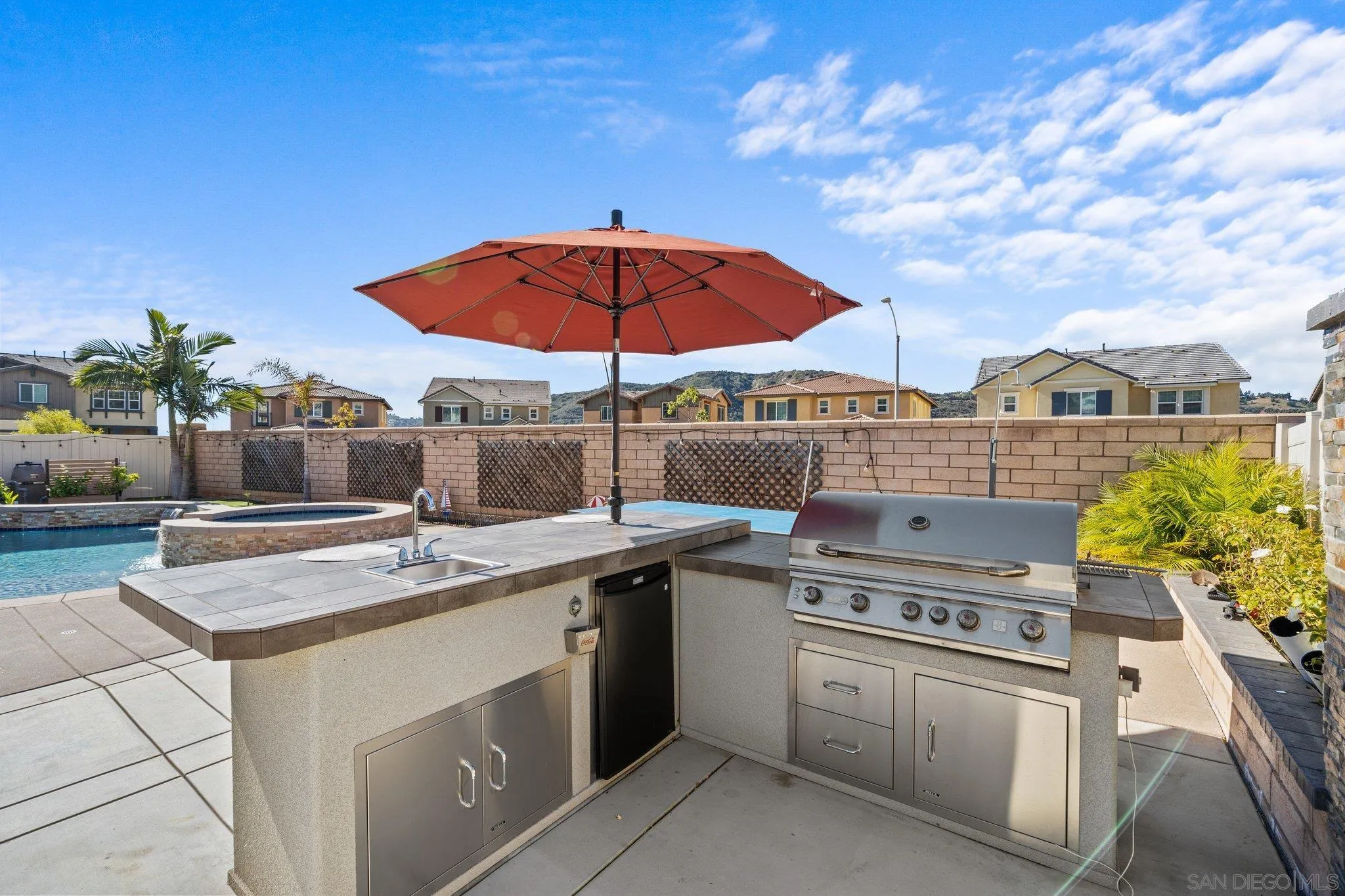 35778 Esperia Way Fallbrook, CA 92028 - Photo 9 of 44 a kitchen with stainless steel appliances granite countertop a stove a sink and a microwave