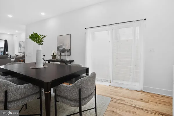 a dining room with table and chairs