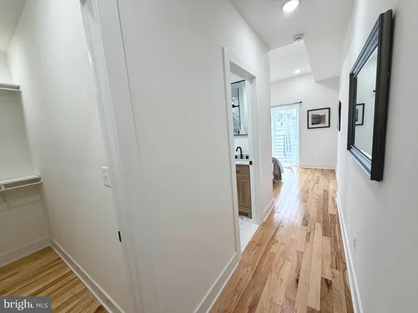a bathroom with a double vanity sink mirror and toilet
