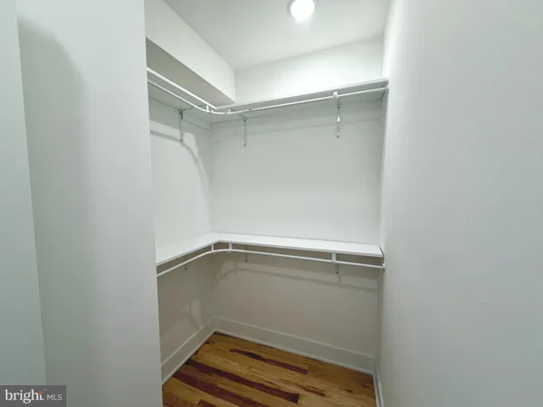 a bed sitting in a bedroom and a table