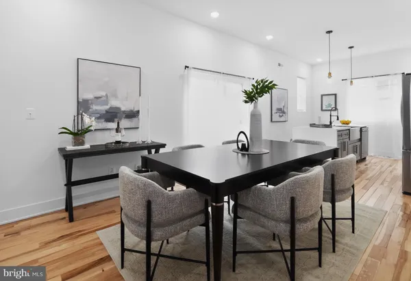 a kitchen with a table and chairs in it