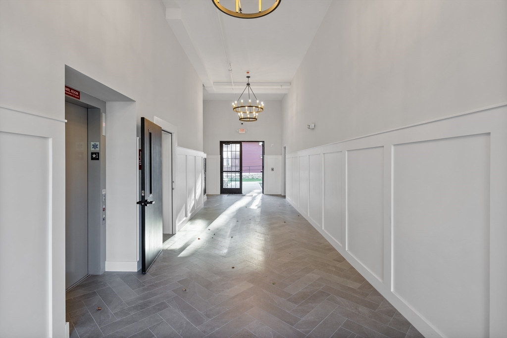 186 Bedford Street, Unit 204 Lexington, MA 02420 - Photo 7 of 10 a view of a hallway with windows