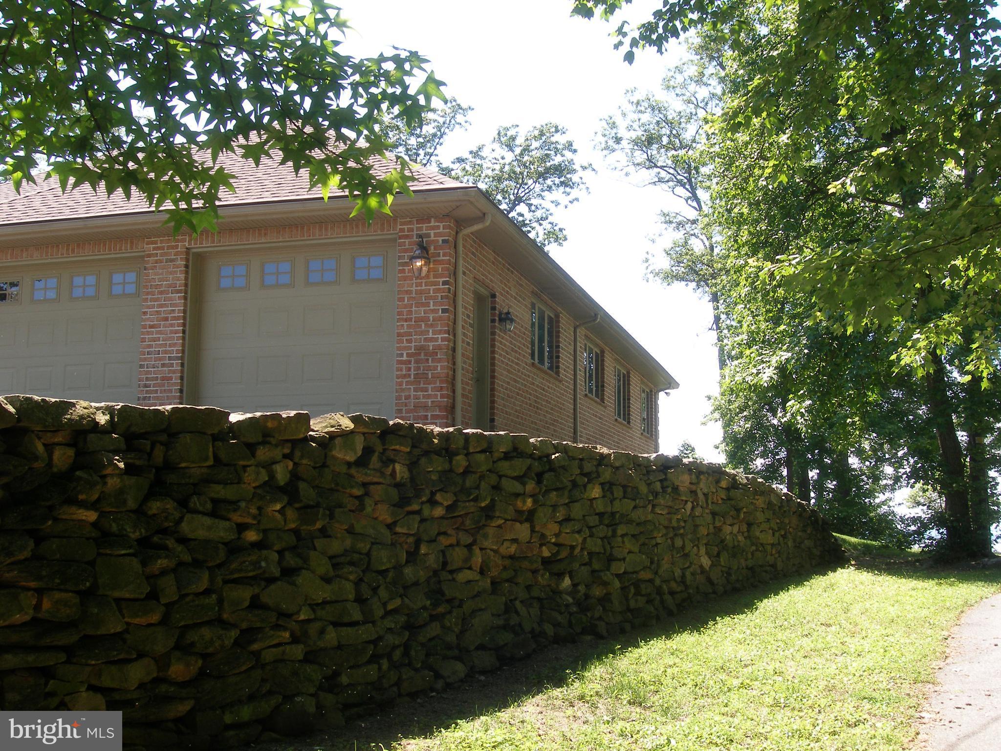 5051 Turkey Point Road North East, MD 21901 - Photo 10 of 30 CUSTOM STONE WALL ON NORTHERN PROPERTY LINE