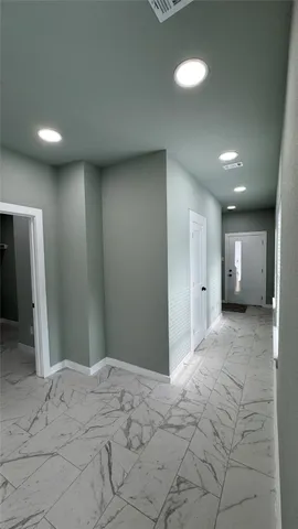 a bathroom with a granite countertop sink a toilet and a shower