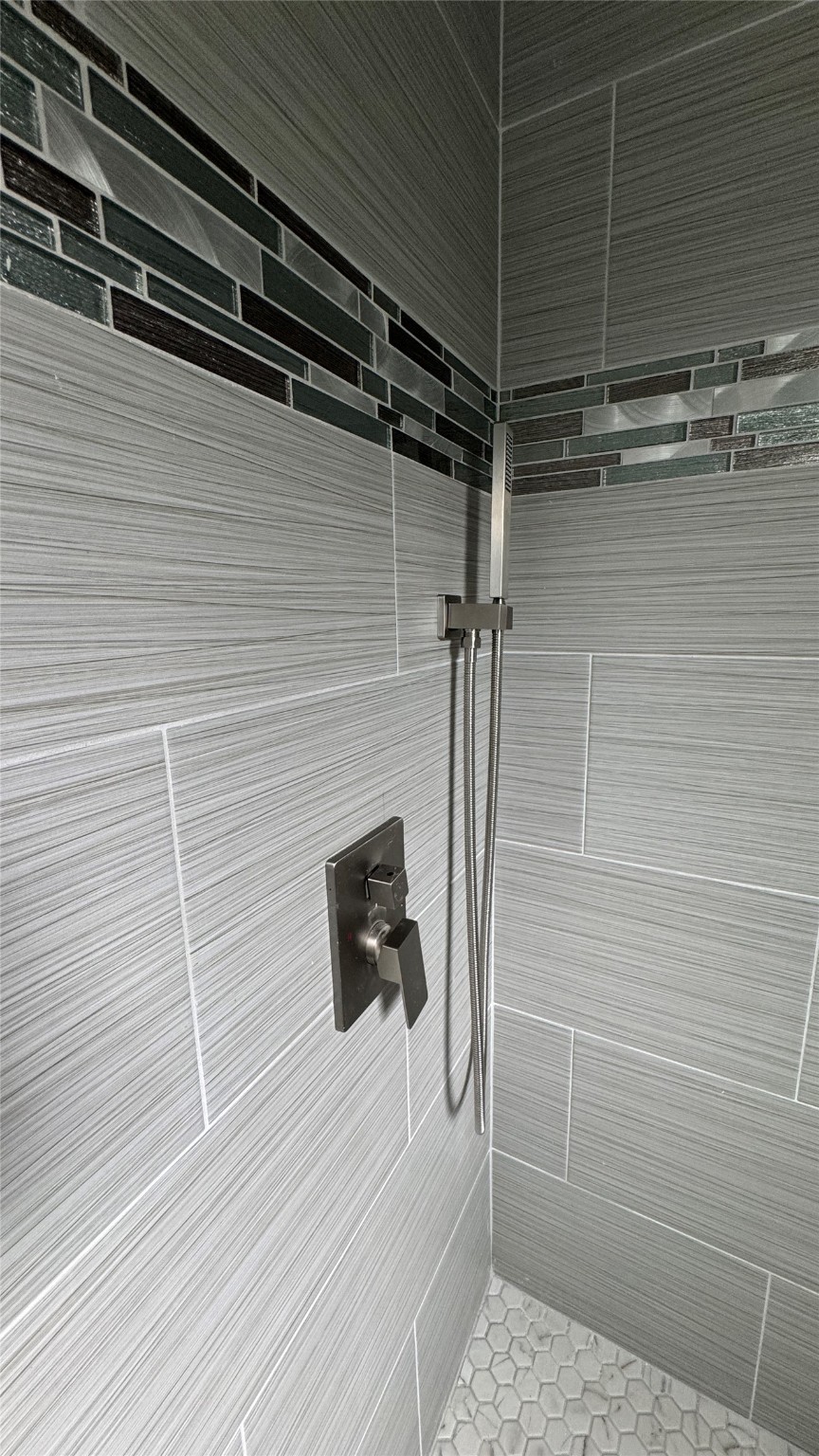 169 South 10th Street Conroe, TX 77301 - Photo 23 of 42 a bathroom with a shower