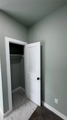 a view of entryway and hall with a window