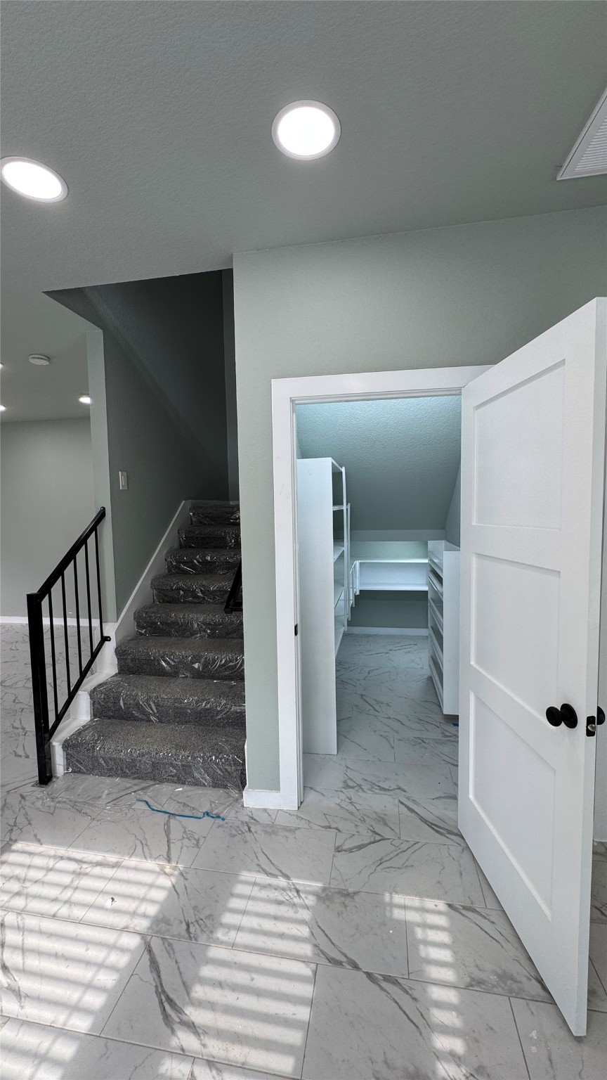 169 South 10th Street Conroe, TX 77301 - Photo 7 of 42 a view of a hallway view with staircase