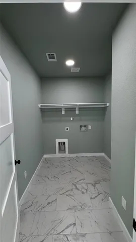 a kitchen with stainless steel appliances a sink a stove a microwave a counter top and cabinets