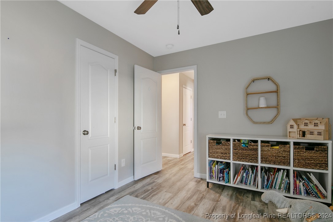 73 Loyalist Road Cameron, NC 28326 - Photo 38 of 42 a view of a big room with wooden floor and windows