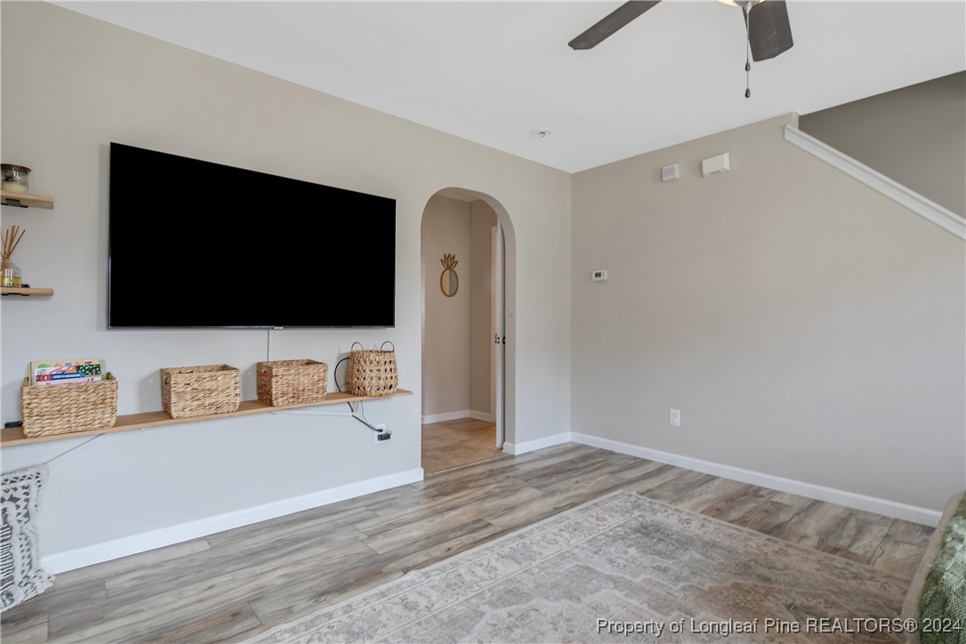 73 Loyalist Road Cameron, NC 28326 - Photo 8 of 42 a living room with furniture and a flat screen tv