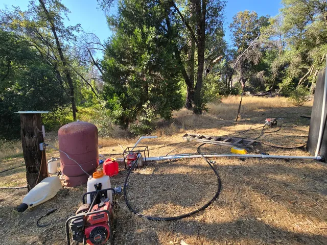 a view of a backyard with sitting area and furniture