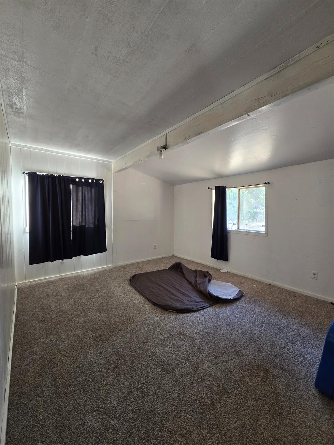 804 Craig Access Road Oroville, CA 95966 - Photo 21 of 31 a room with a window and a ceiling fan
